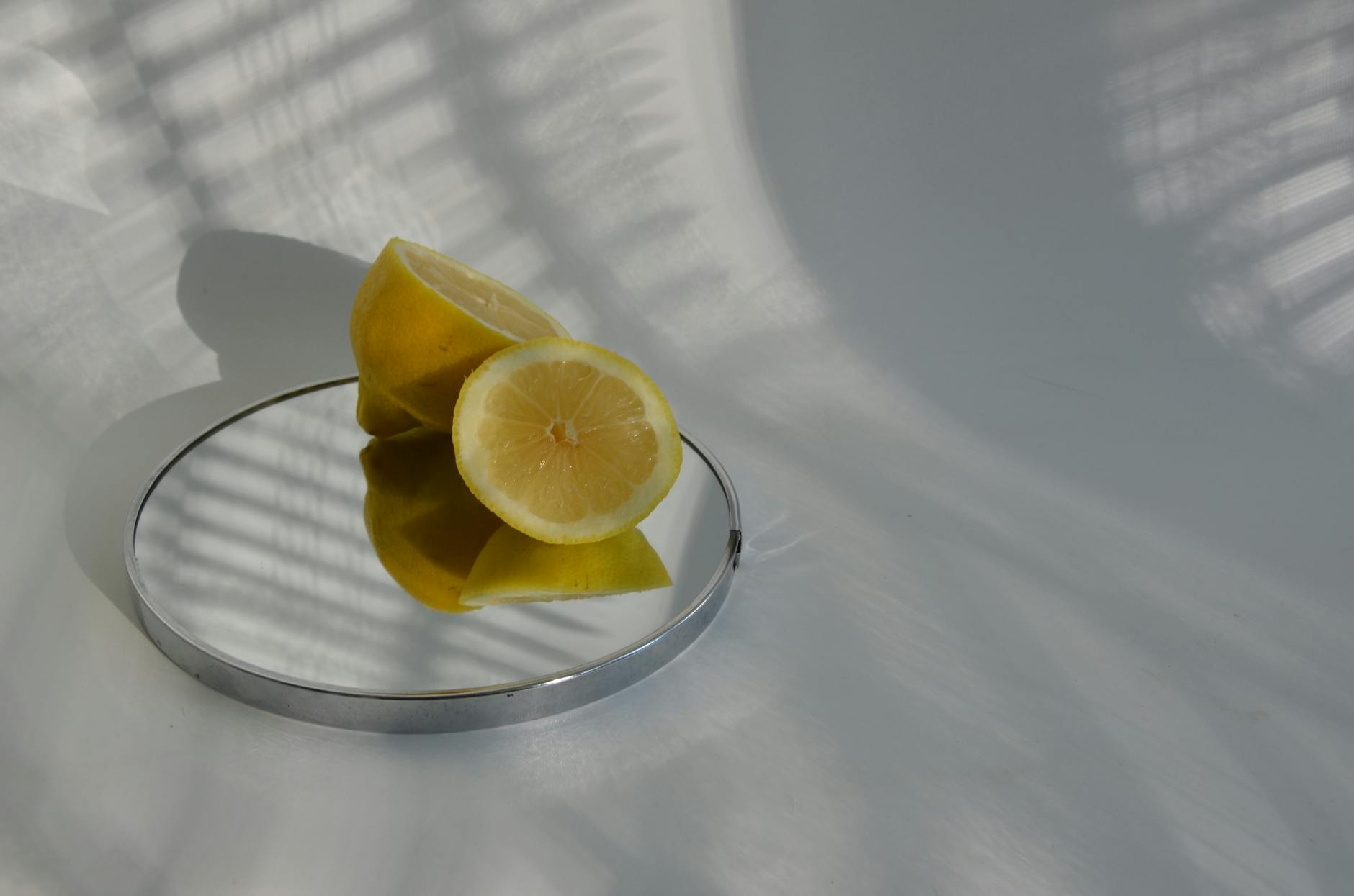 Blue clitoral vibrator surrounded by flowers and citrus, symbolizing pleasure and intimacy in long-term relationships